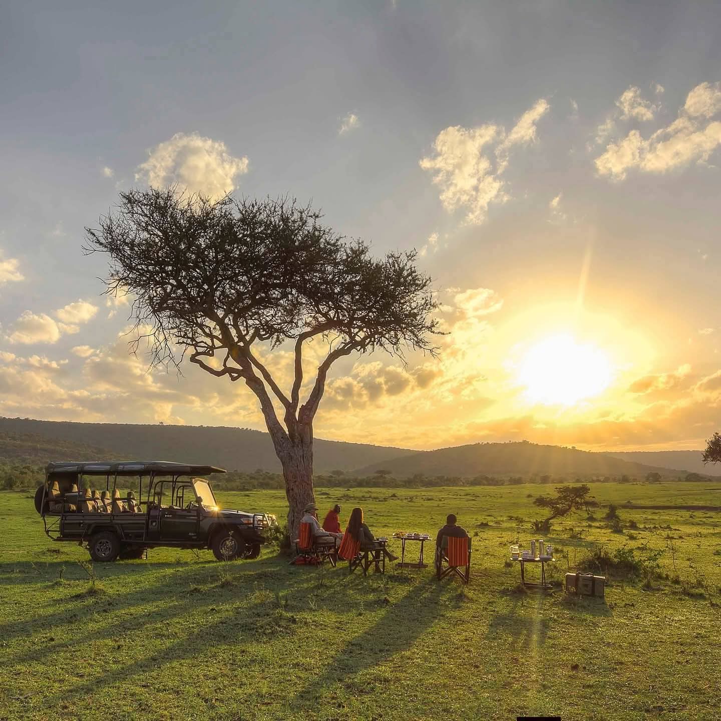 Enjoy a magical sundowner in the park as the sun sets over the savannah, painting the sky in warm hues perfect for relaxing with a drink while surrounded by nature and wildlife.
